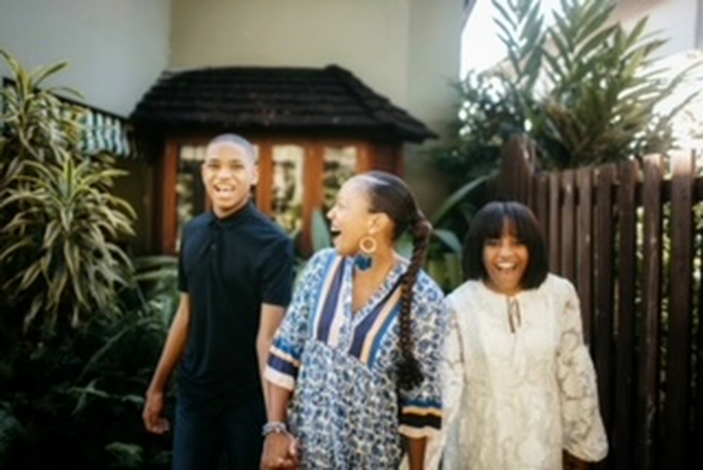 Francene Noel walking hand in hand with her children