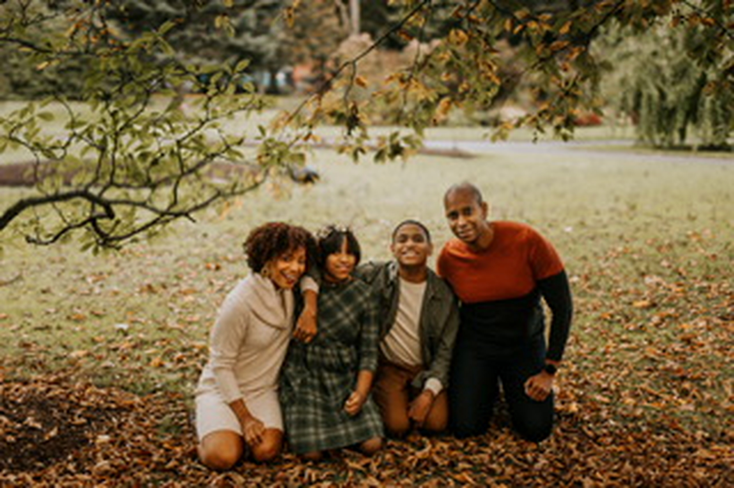 Francene Noel and her family sharing a joyful moment outdoors